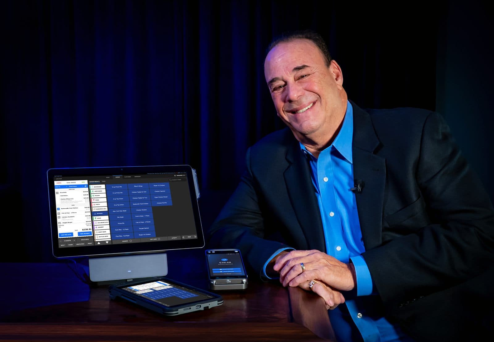 Jon Taffer alongside a Shift4 Dine point-of-sale system